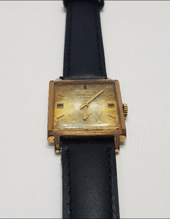 ALTIN KAPLAMA HISLON MARKA KOL SAATİ 