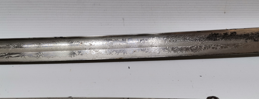 SAPI ŞAŞKA FORMUNDA YAPILMIŞ OSMANLI DÖNEMİ ÖZEL YAPIM SUBAY KILICI