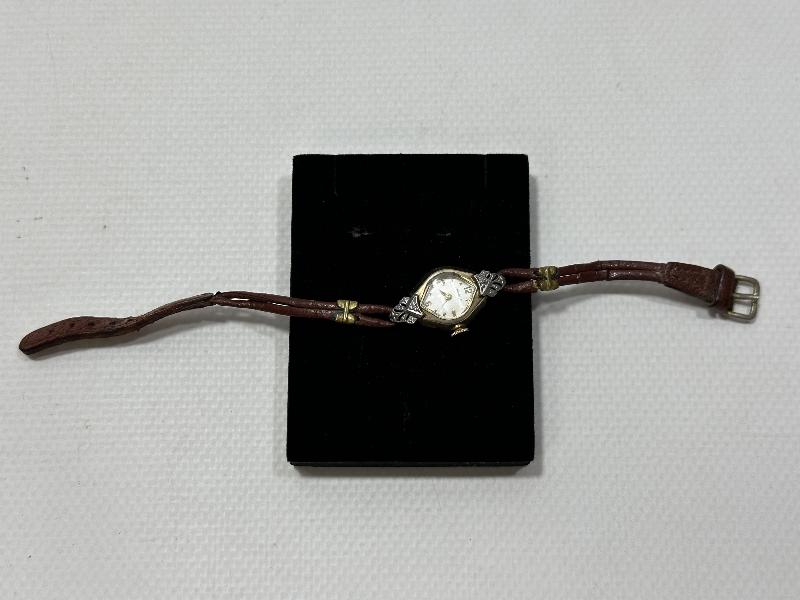 ANTİKA CARAVELLE MARKA ALTIN KAPLAMA KURMALI BAYAN KOL SAATİ 