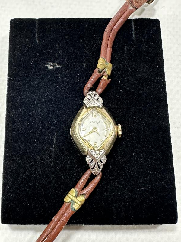 ANTİKA CARAVELLE MARKA ALTIN KAPLAMA KURMALI BAYAN KOL SAATİ 