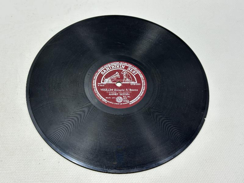 TAŞ PLAK : AHMET SEZGİN 