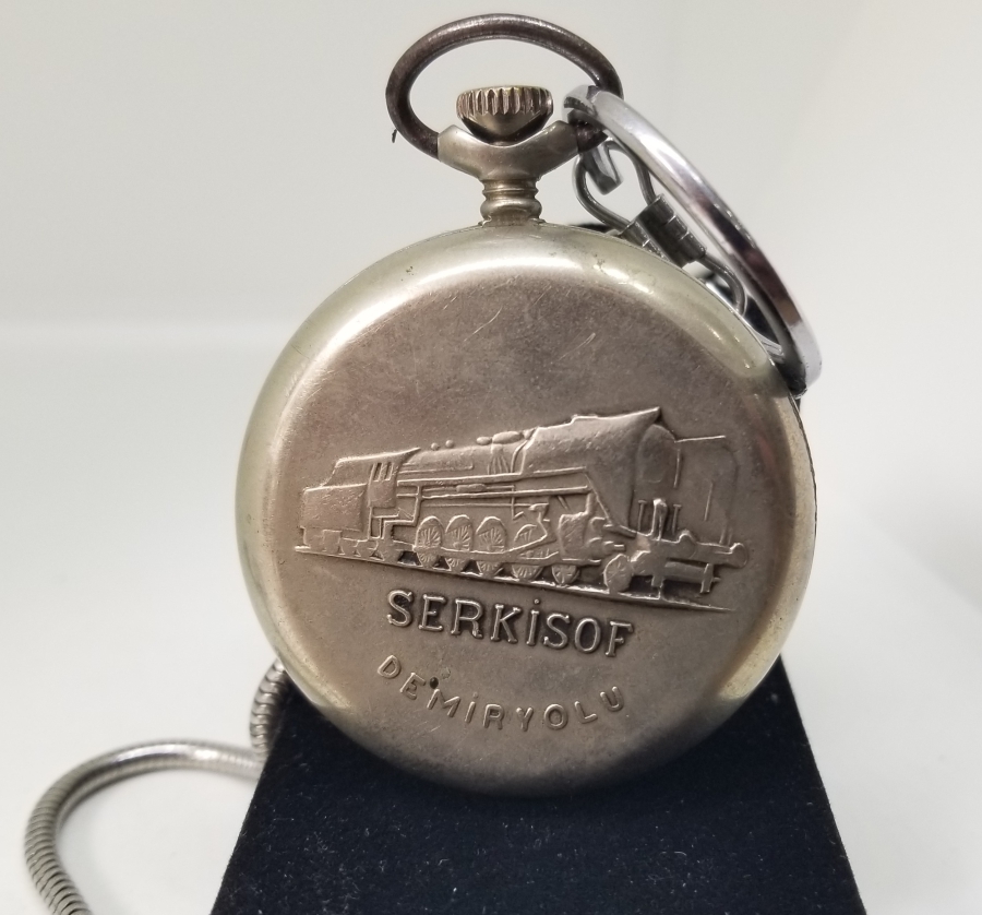 ORİJİNAL KÖSTEĞİYLE ARKASI TRENLİ SERKİSOF MARKA KURMALI CEP SAATİ