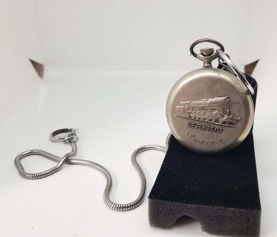 ORİJİNAL KÖSTEĞİYLE ARKASI TRENLİ SERKİSOF MARKA KURMALI CEP SAATİ