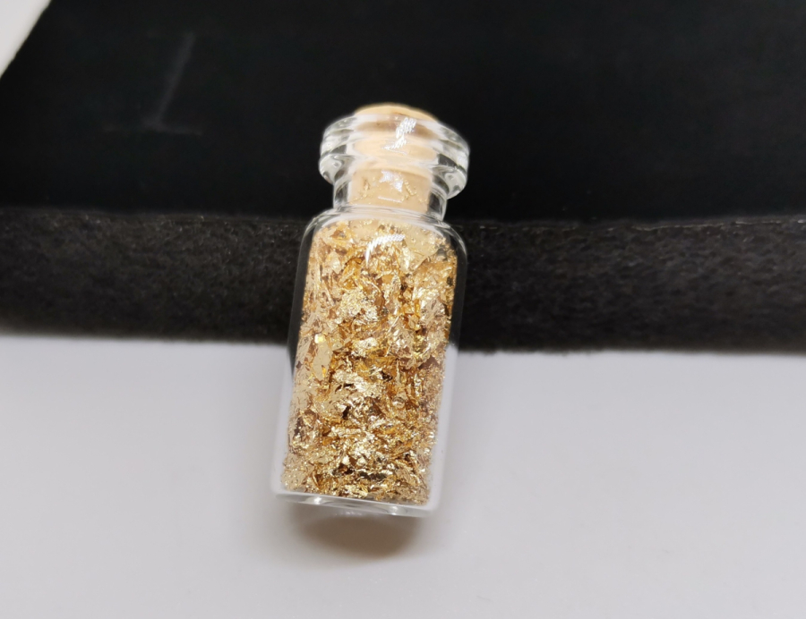 İÇİNDE SAF ALTIN PARÇALAR BULUNAN ŞİŞE