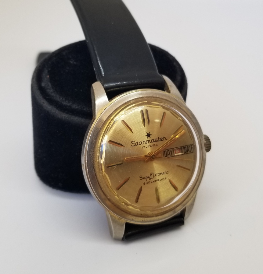 STARMASTER MARKA ALTIN KAPLAMA KURMALI VE TAKVİMLİ KOL SAATİ