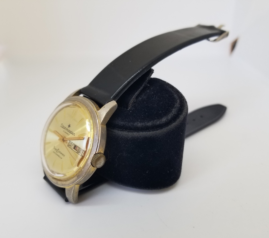 STARMASTER MARKA ALTIN KAPLAMA KURMALI VE TAKVİMLİ KOL SAATİ