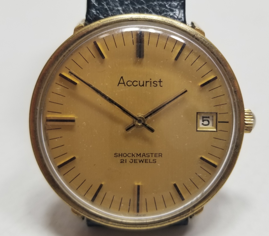 ACCURIST MARKA KURMALI VE TAKVİMLİ ANTİKA KOL SAATİ