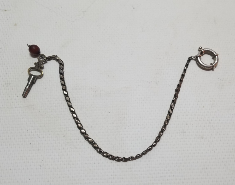 BAKLALI FORMDA YAPILMIŞ ANTİKA GÜMÜŞ CEP SAATİ KÖSTEĞİ