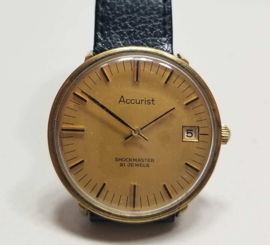 ACCURIST MARKA KURMALI VE TAKVİMLİ ANTİKA KOL SAATİ